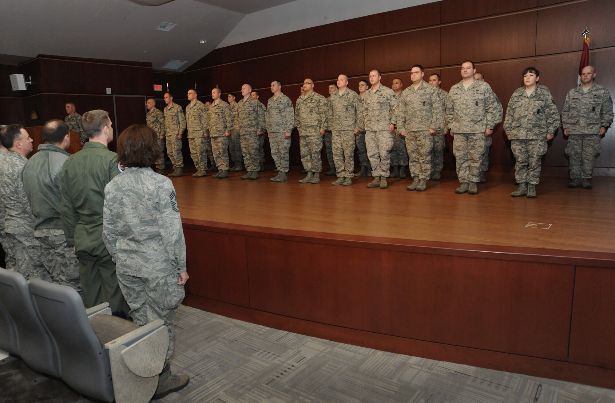Oregon Air National Guard senior leaders stand (to the left) as they acknowledge members of the 142nd Fighter Wing Security Forces during the mobilization ceremony for the 142nd Fighter Wing Security Forces Squadron at Camp Withycombe, Ore., Dec. 11, 2012. (U.S. Air Force photograph by Tech. Sgt. John Hughel, 142nd Fighter Wing Public Affairs/Released)