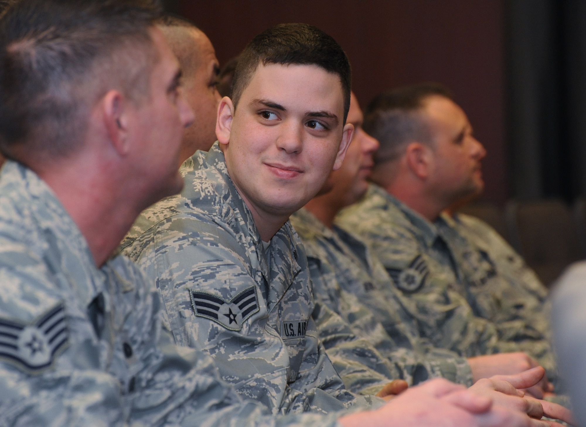 Oregon Air National Guard Senior Airman James A. Kalmbach, 142nd Fighter Wing Security Forces Squadron, relaxes for a few moments with some of his fellow airmen, prior to the mobilization ceremony for the 142nd Fighter Wing Security Forces Squadron at Camp Withycombe, Ore., Dec. 11, 2012. (U.S. Air Force photograph by Tech. Sgt. John Hughel, 142nd Fighter Wing Public Affairs/Released)