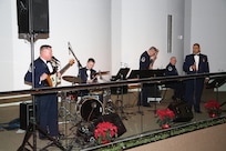 Members of Warhawk, a popular music ensemble of the Band of West, perform during the Holiday in Blue concert Dec. 7 at the Edgewood Independent School District Theatre of Performing Arts in San Antonio.  Warhawk travels over 30,000 miles each year and performs classic rock'n'roll, traditional country and current pop music. (U.S. Air Force photo/Joel Martinez)