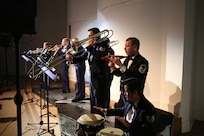 The Band of the West's brass ensemble, Gateway Brass, performs during the Holiday in Blue concert Dec. 7 at the Edgewood Independent School District Theatre of Performing Arts in San Antonio.  Gateway Brass travels more than 20,000 miles and appears in more than 100 concerts and clinics annually. (U.S. Air Force photo by Joel Martinez)