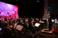 U.S. Air Force Capt. Michael Hoerber, Band of the West commander, conducts the band at the Holiday in Blue concert Dec. 7 at the Edgewood Independent School District Theater of Performing Arts in San Antonio.  The Band of the West provides hundreds of performances to military and civilian audiences throughout the year. (U.S. Air Force photo by Joel Martinez)