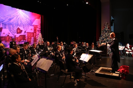 U.S. Air Force Capt. Michael Hoerber, Band of the West commander, conducts the band at the Holiday in Blue concert Dec. 7 at the Edgewood Independent School District Theater of Performing Arts in San Antonio.  The Band of the West provides hundreds of performances to military and civilian audiences throughout the year. (U.S. Air Force photo by Joel Martinez)