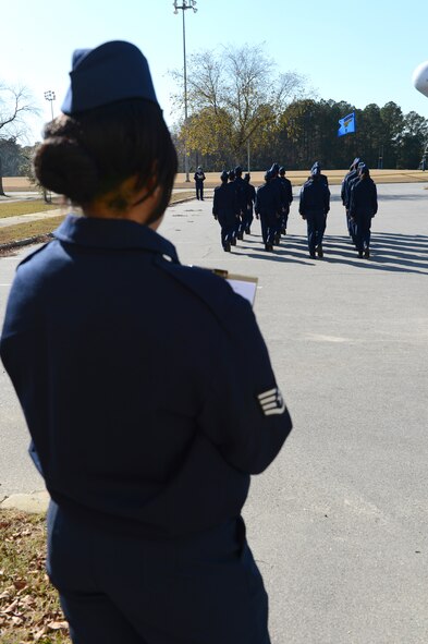 Staff Sgt. Shawn Ika Danielson, 20th Logistics Readiness Squadron fuels distribution supervisor, judges an Air Force Junior ROTC drill competition at Sumter High School, S.C., Nov. 29, 2012. Danielson and three other Airmen from Shaw Air Force Base, S.C., volunteered to judge six teams composed of JROTC cadets in 9th to 12th grade. (U.S. Air Force photo by Airman 1st Class Krystal M. Jeffers/Released)