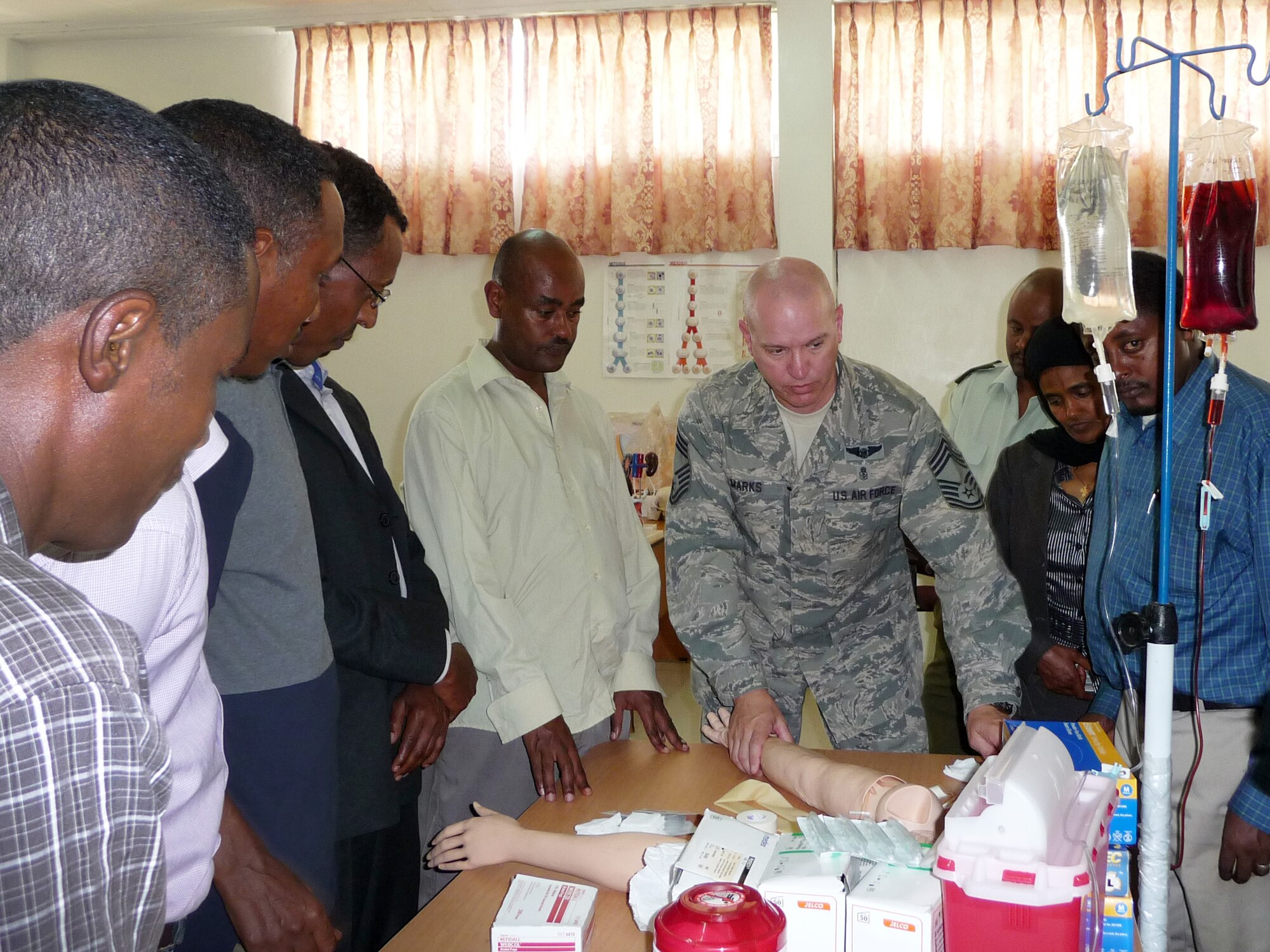 Chief Master Sgt. Adam Marks teaches a class of surgeons, public health officers and registered nurses about mass casualty response in Ethiopia.  Marks was part of an Air Force and Navy team deployed to the area to provide health care education and training. (Courtesy Photo)