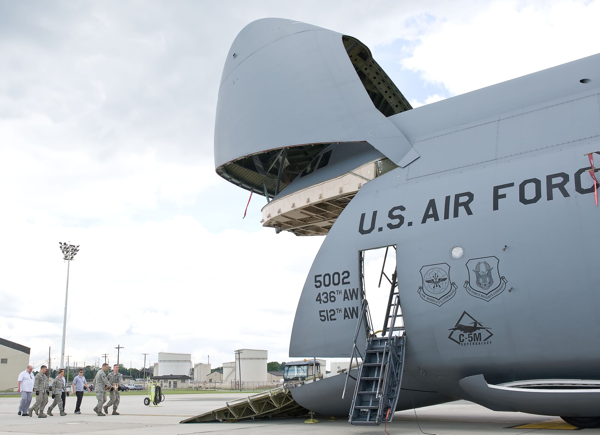 Members of the 436th Aerial Port Squadron and the ?Cake Boss? cast load a special birthday cake for the U.S. Army onto a C-5M Super Galaxy June 6, 2012, at Dover Air Force Base, Del. The cake was made by Buddy Valastro and his family at Carlo's Bakery in Hoboken, N.J., which is part of The Learning Channel's reality show "Cake Boss." The U.S. Air Force delivered the cake to Army personnel deployed to Afghanistan in time for the Army's 237th birthday June 14, 2012.  (U.S. Air Force photo/Roland Balik)