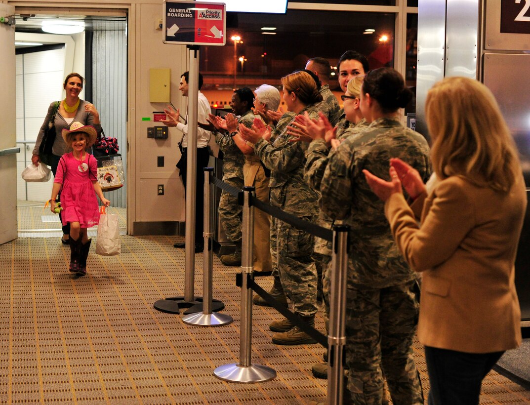 Joint Base Andrews Airmen applaud during a homecoming celebration for the Snowball Express at Ronald Reagan Washington National Airport, Washington, D.C., Dec. 4, 2012. The Snowball Express is Honors America’s fallen military service members who have made the ultimate sacrifice since Sept. 11, 2001 by humbly serving the families they left behind. (U.S. Air Force photo/ Airman 1st Class Erin O'Shea)