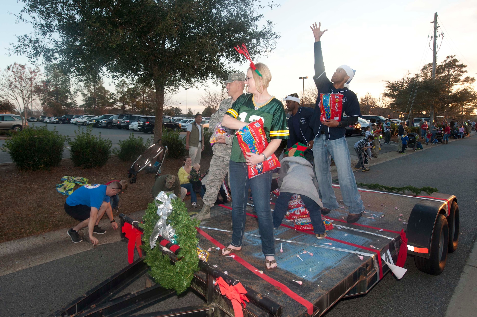 U.S. Air Force first sergeants throw candy to family members watching the Annual Base Tree Lighting and Holiday Parade Dec. 7, 2012. The parade also featured appearances by the 23d Civil Engineer Squadron fire department, Green Knight members, the Grinch, Santa Claus and more. (U.S. Air Force photo by Airman Paul Francis/Released)
