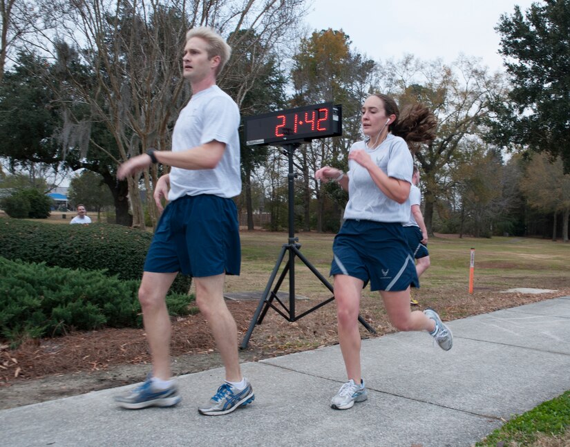 Capt. Marie Harnly (right), 628th Civil Engineering Squadron, is the first female runner to complete the 5K Commander's Challenge Run at Joint Base Charleston - Air Base, Dec.7, 2012, with a time of 21:42. (U.S. Air Force photo/Airman 1st Class Ashlee Galloway)