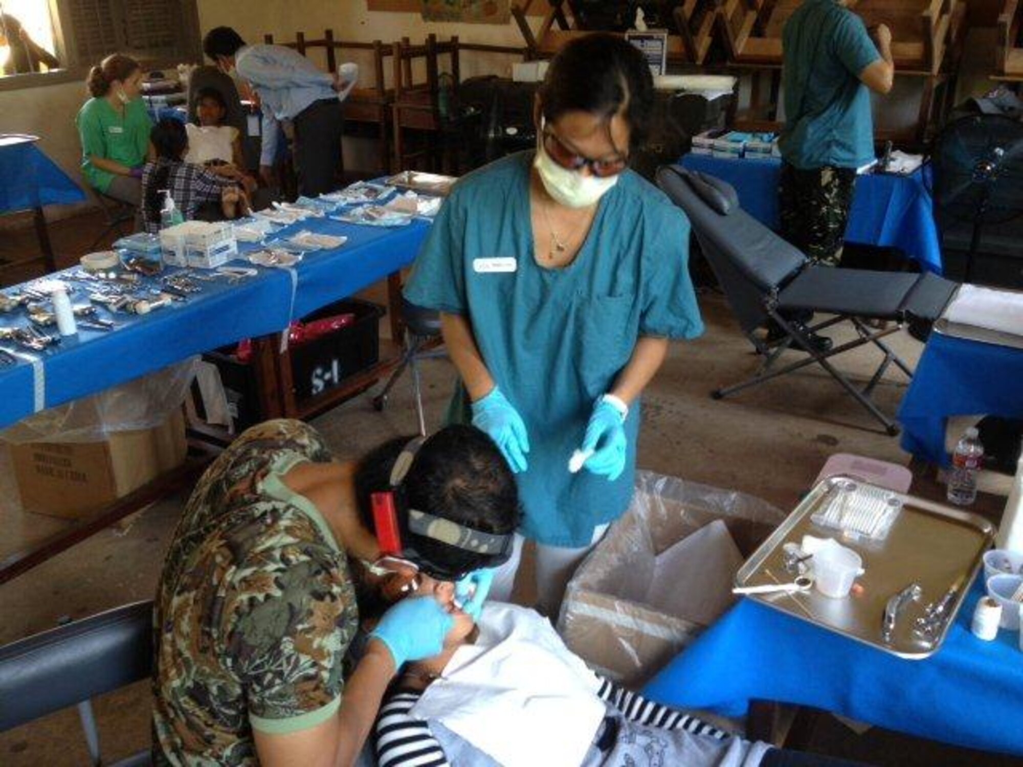 A child receives dental treatment in Southeast Asia. Medical professionals from the Air Force, Army and Navy as well as members from U.S. Public Health Service and nongovernmental organizations educated and cared for more than 10,000 patients during a five-month humanitarian mission to regions of Southeast Asia aboard the USNS Mercy . (Courtesy photo)