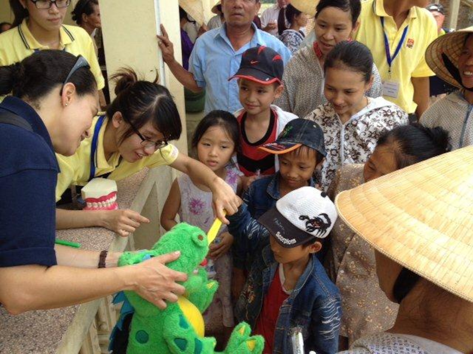 Children living in Southeast Asia are educated about oral hygiene during a humanitarian mission. Medical professionals from the Air Force, Army and Navy as well as members from U.S. Public Health Service and nongovernmental organizations visited remote regions of Southeast Asia to treat tooth decay and inform the public about preventive dental practices for healthier oral hygiene. (Courtesy photo)