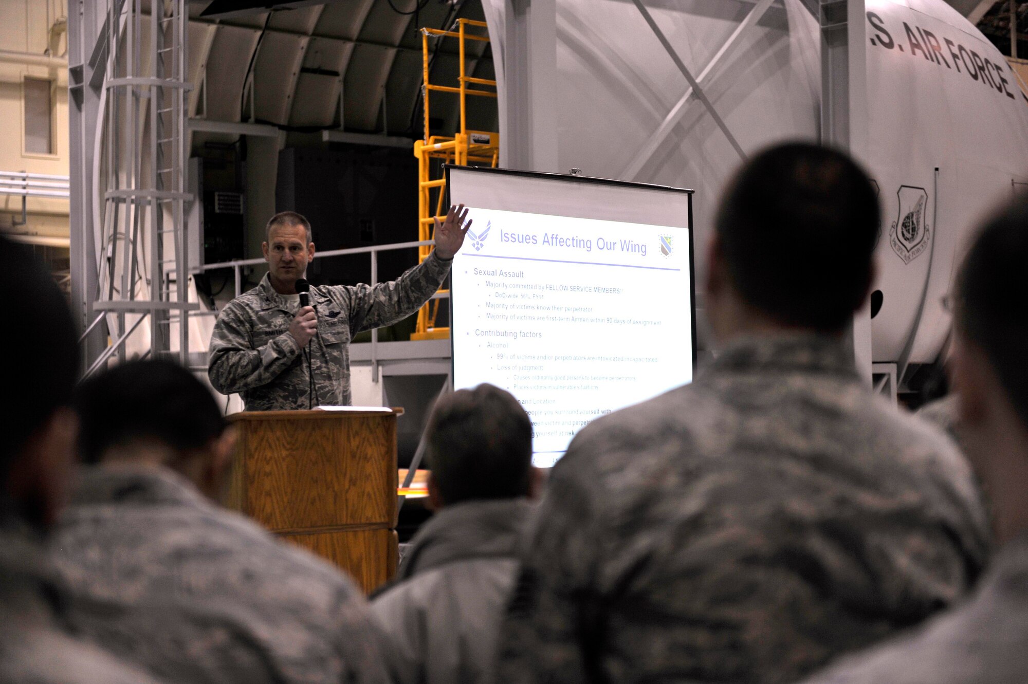 JOINT BASE ELMENDORF-RICHARDSON, Alaska -- Air Force Col. Dirk Smith, 3rd Wing commander, briefs 3rd Wing service members during the 3rd Wing Commander's Briefing about sexual assault Dec. 6. (U.S. Air Force photo/Airman Ty-Rico Lea)