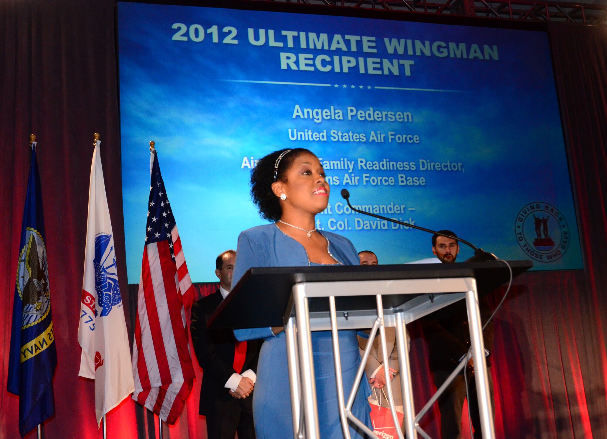 Angela Pedersen, 94th Airlift Wing director of Airman and Family Readiness was honored on Nov. 15 at the Cobb Energy Center for her dedication to the Dobbins community and giving freely her time. Pedersen, the only civilian honored, was recognized along with several Service members of varying rank and career fields for being ultimate wingmen to those around them. (U.S. Air Force photo/Senior Airman Elizabeth Van Patten)