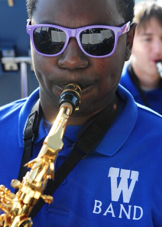 A saxophone player from the Wheatland High School band plays holiday tunes during the Children's Holiday Party Dec. 8, 2012, at Beale Air Force Base, Calif. More than 75 volunteers from Beale and the surrounding community provided face painting, pictures, crafts and food while the band played holiday music. (U.S. Air Force photo by Senior Airman Shawn Nickel/Released)
