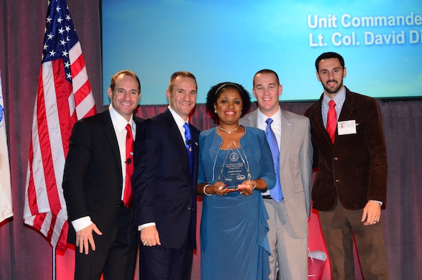 Angela Pedersen, 94th Airlift Wing director of Airman and Family Readiness was honored on Nov. 15 at the Cobb Energy Center for her dedication to the Dobbins community and giving freely her time. Pedersen, the only civilian honored, was recognized along with several Service members of varying rank and career fields for being ultimate wingmen to those around them. (U.S. Air Force photo/Senior Airman Elizabeth Van Patten)