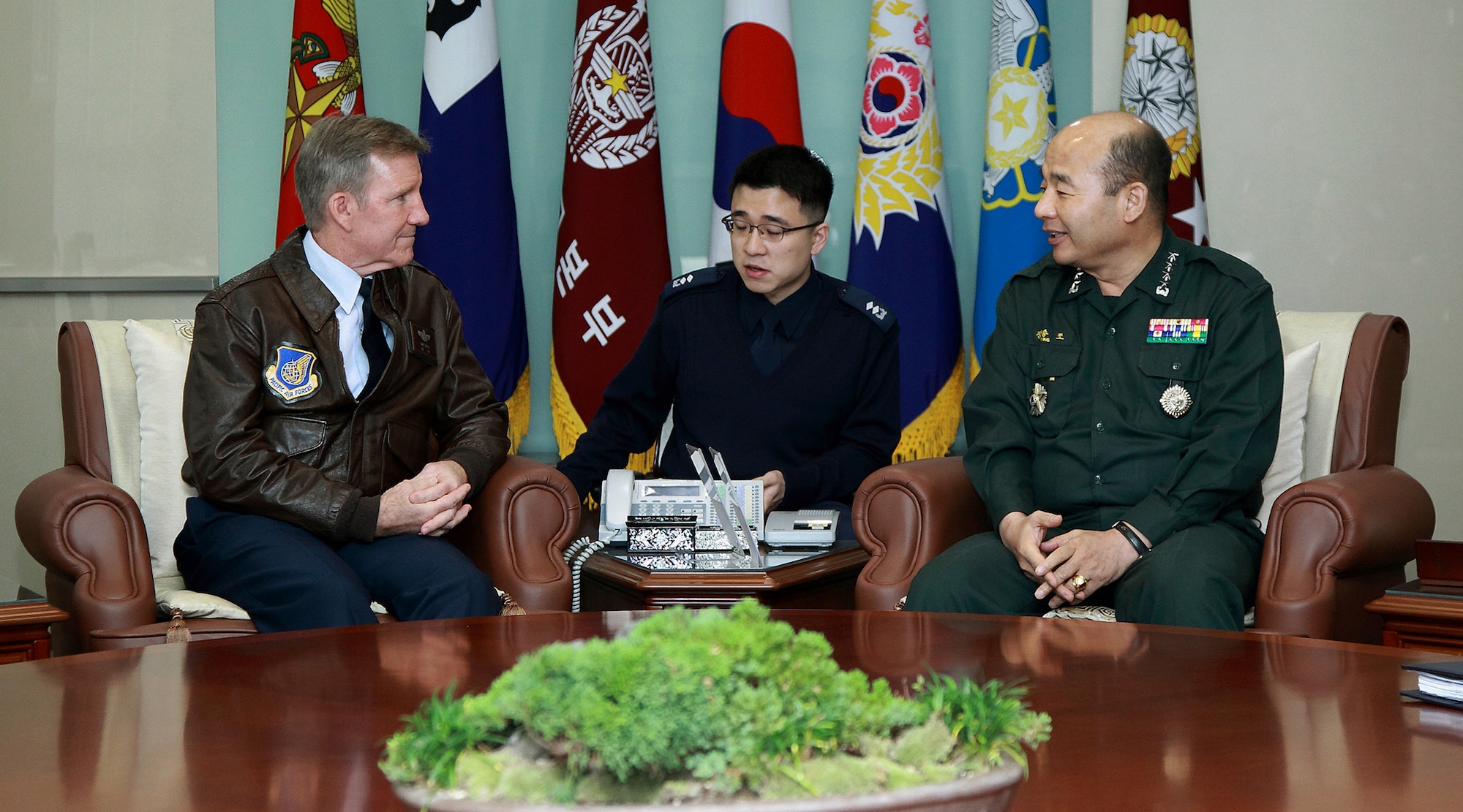 Gen. Herbert “Hawk” Carlisle, Pacific Air Forces commander, and Republic of Korea Joint Chiefs of Staff Chairman Gen. Seung-jo Jung (right), with his interpreter (center), discuss the importance of affirming the strength of the US-ROK partnership at the ROK JCS headquarters at Daejeon, South Korea, Nov. 30, 2012. (Courtesy photo)