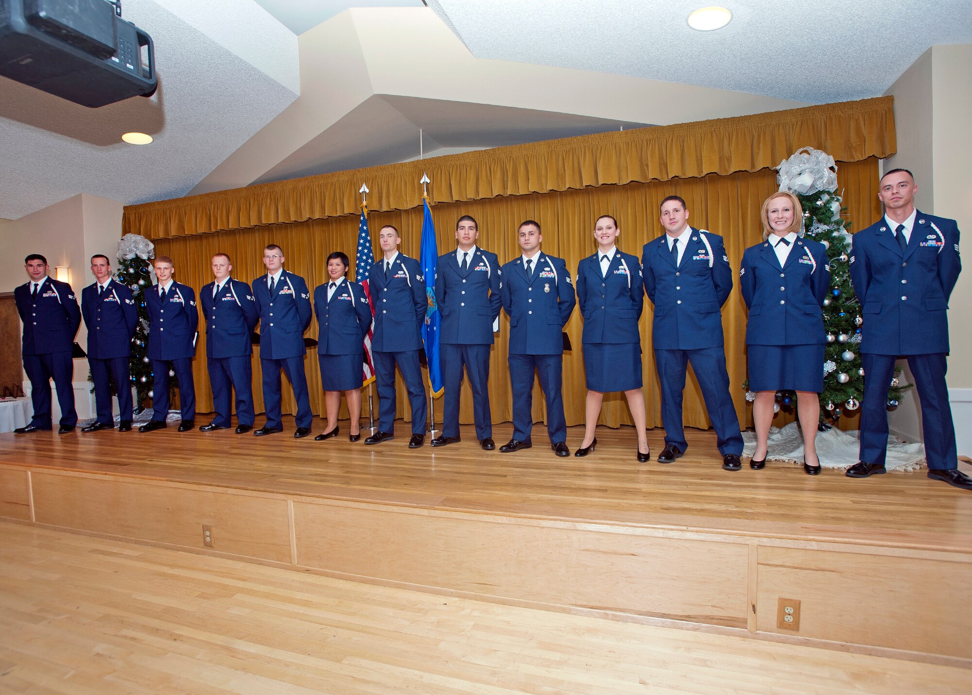 Graduates of Airman Leadership School Class 13-A pose for photos at Club Muroc during their graduation ceremony Dec. 5. Thirteen Airmen took the next step in their military careers.  (U.S. Air Force photo by Ethan Wagner) 