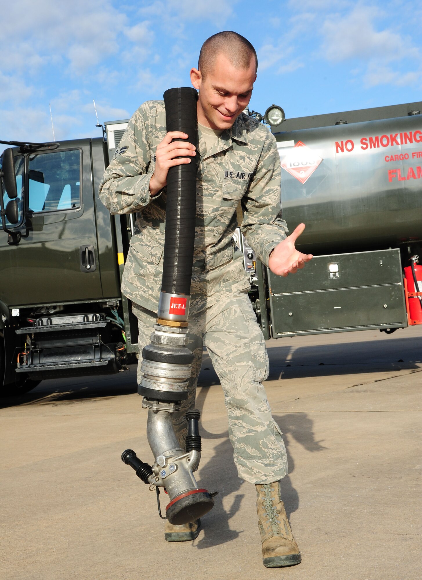 Airman 1st Class Mark Baker, a 19th Logistics Readiness Squadron fuels fixed facilities apprentice, pulls a fuel hose to a C-130J Dec. 5, 2012, at Little Rock Air Force Base, Ark. Baker, a Norco, Calif., native, successfully completed his career development courses and he strides to be the most knowledgeable in the job. (U.S. Air Force photo by Airman 1st Class Kaylee Clark)


