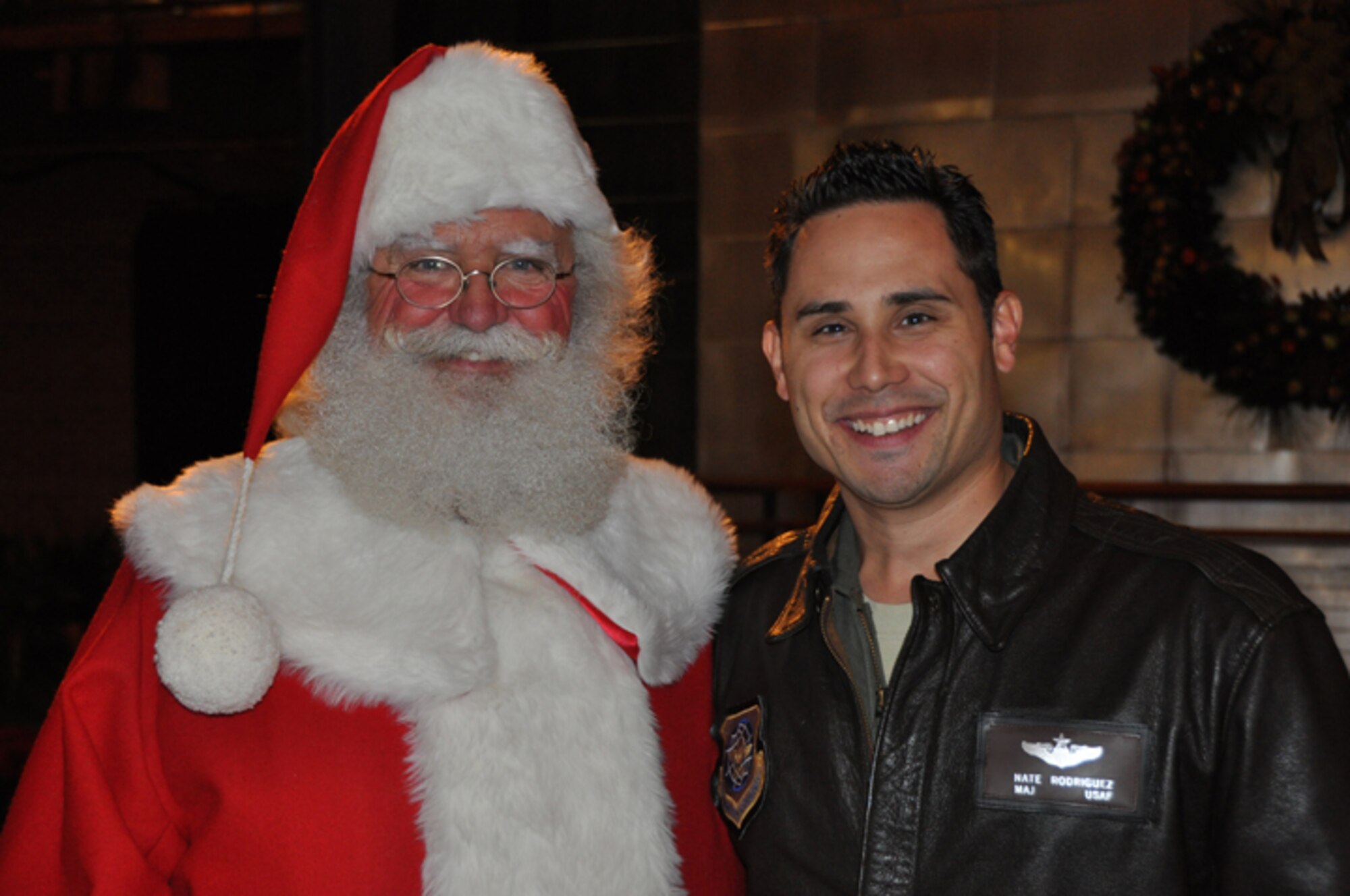 Maj. Nate Rodriguez, 911th Air Refueling Squadron, snaps a photo with another flier in early December. Rodriguez was a participant in the Durham Tower Lighting on Dec. 7, 2012. (USAF photo by Maj. Shannon Mann, 916ARW/PA)