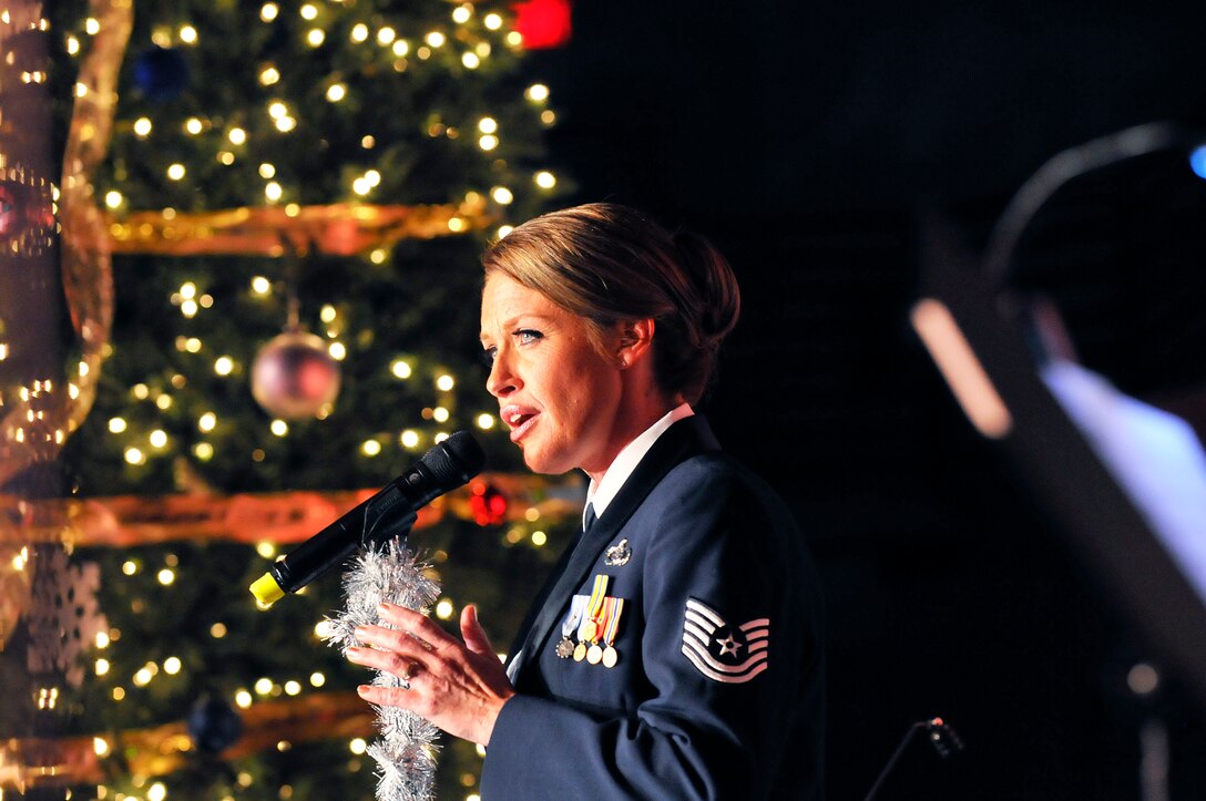 Tech Sgt. Alyson Jones sings "I'll be Home for Christmas" as a dedication to deployed military and their families during The Band of the U.S. Air Force Reserve's 51st  Annual Holiday Concert Dec. 6. (U. S. Air Force photo/Sue Sapp)