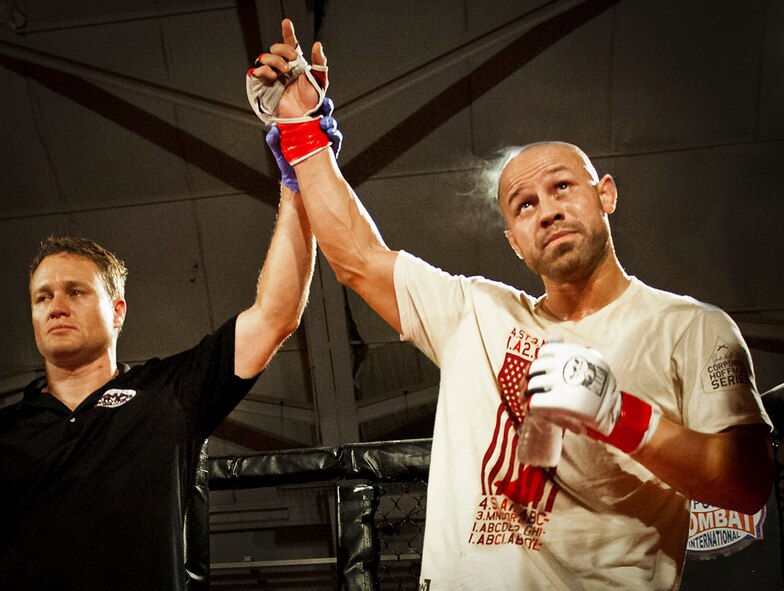 Danny Ruiz is declared the victor at the mixed martial arts main event at Strike Fight Dec. 8 at Eglin Air Force Base, Fla.  Ruiz, an Air Force Reserve staff sergeant with the 919th Special Operations Wing, won by unanimous decision in one of 11 matches held at the base’s first-ever MMA event.  The debut event drew approximately 775 people.  (U.S. Air Force photo/Samuel King Jr.)