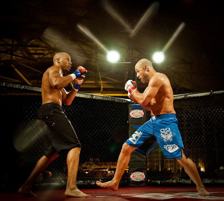 Danny Ruiz moves toward William “The Slim Reaper” Kuhn during the mixed martial arts main event at Strike Fight Dec. 8 at Eglin Air Force Base, Fla.  Ruiz, an Air Force Reserve staff sergeant with the 919th Special Operations Wing, won by unanimous decision in one of 11 matches held at the base’s first-ever MMA event.  The debut event drew approximately 775 people.  (U.S. Air Force photo/Samuel King Jr.)