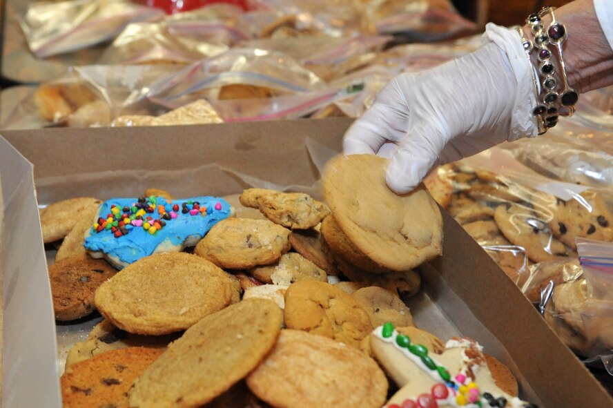Luke members package up cookies for dorm residents Dec. 10 during the Airman Cookie Drive held at Club Five Six, Luke Air Force Base, Ariz. (U.S. Air Force photo by Senior Airman Sandra Welch)
