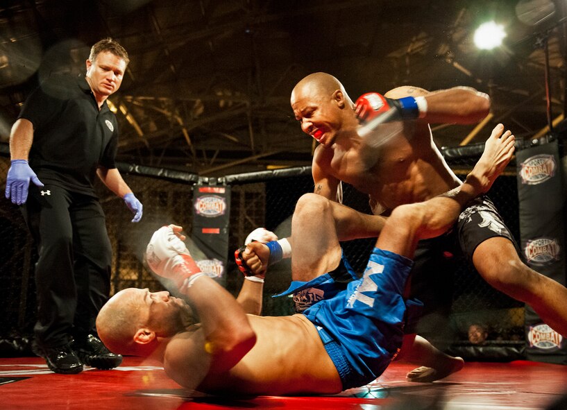 William “The Slim Reaper” Kuhn attacks Danny Ruiz during the mixed martial arts main event at Strike Fight Dec. 8 at Eglin Air Force Base, Fla.  Ruiz, an Air Force Reserve staff sergeant with the 919th Special Operations Wing, won by unanimous decision in one of 11 matches held at the base’s first-ever MMA event.  The debut event drew approximately 775 people.  (U.S. Air Force photo/Samuel King Jr.)