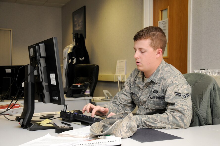 Airman 1st Class Carl Clements, 100th Force Support Squadron force management journeyman from Yuba City, Calif., updates a member’s unfavorable information file management record Dec. 11, 2012, at RAF Mildenhall, England. The military personnel section also processes Enlisted Performance Reports and decorations for RAF Mildenhall, RAF Alconbury and RAF Croughton personnel. (U.S. Air Force photo by Gina Randall/Released)