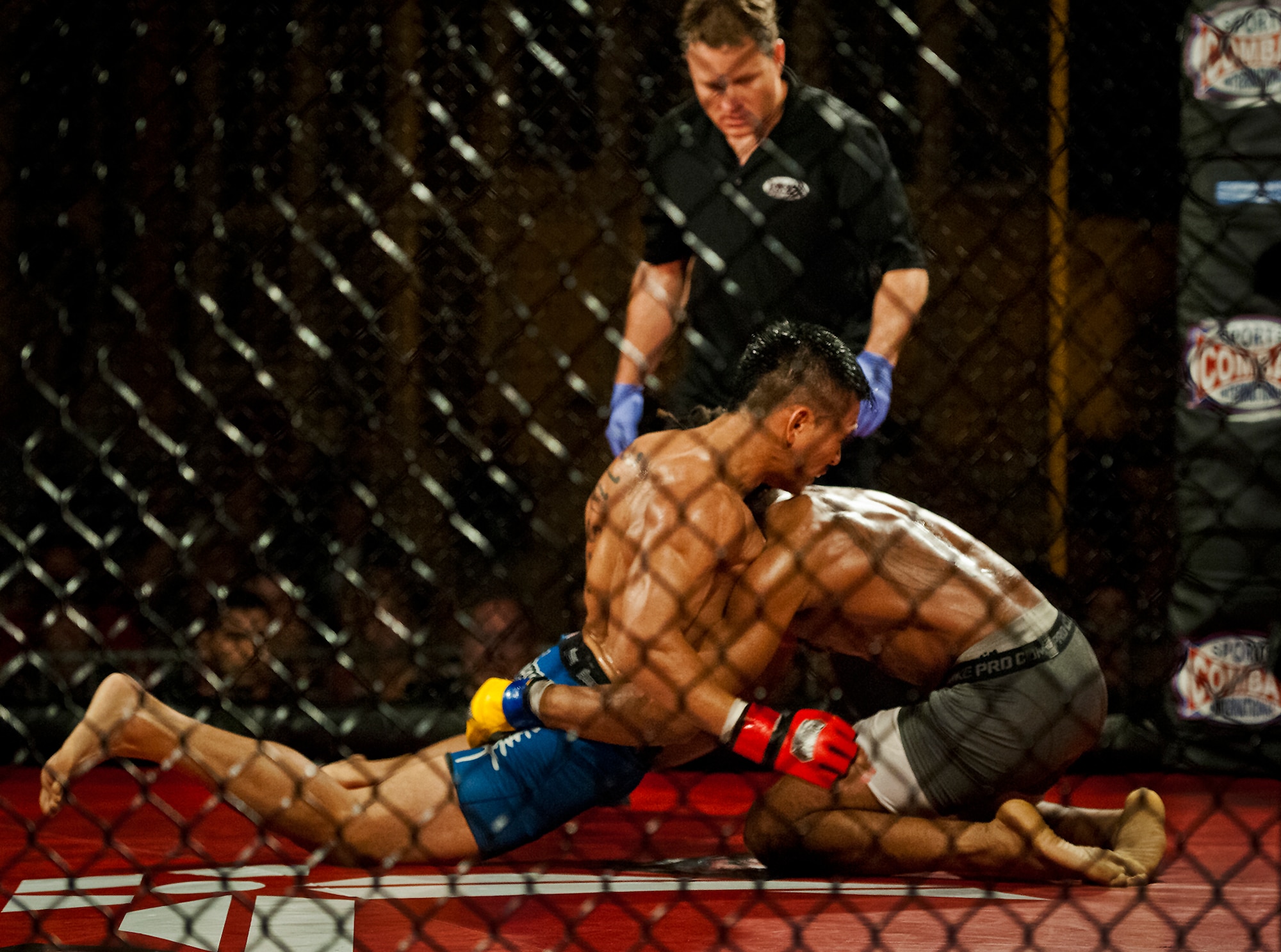 Kit Vongprachnah leans forward against Corey Wilson in their mixed martial arts bout at the Strike Fight event Dec. 8 at Eglin Air Force Base, Fla.  Vongprachnah won a split decision over Wilson in one of 11 matches held at the base’s first-ever MMA event that drew approximately 775 people.  (U.S. Air Force photo/Samuel King Jr.)