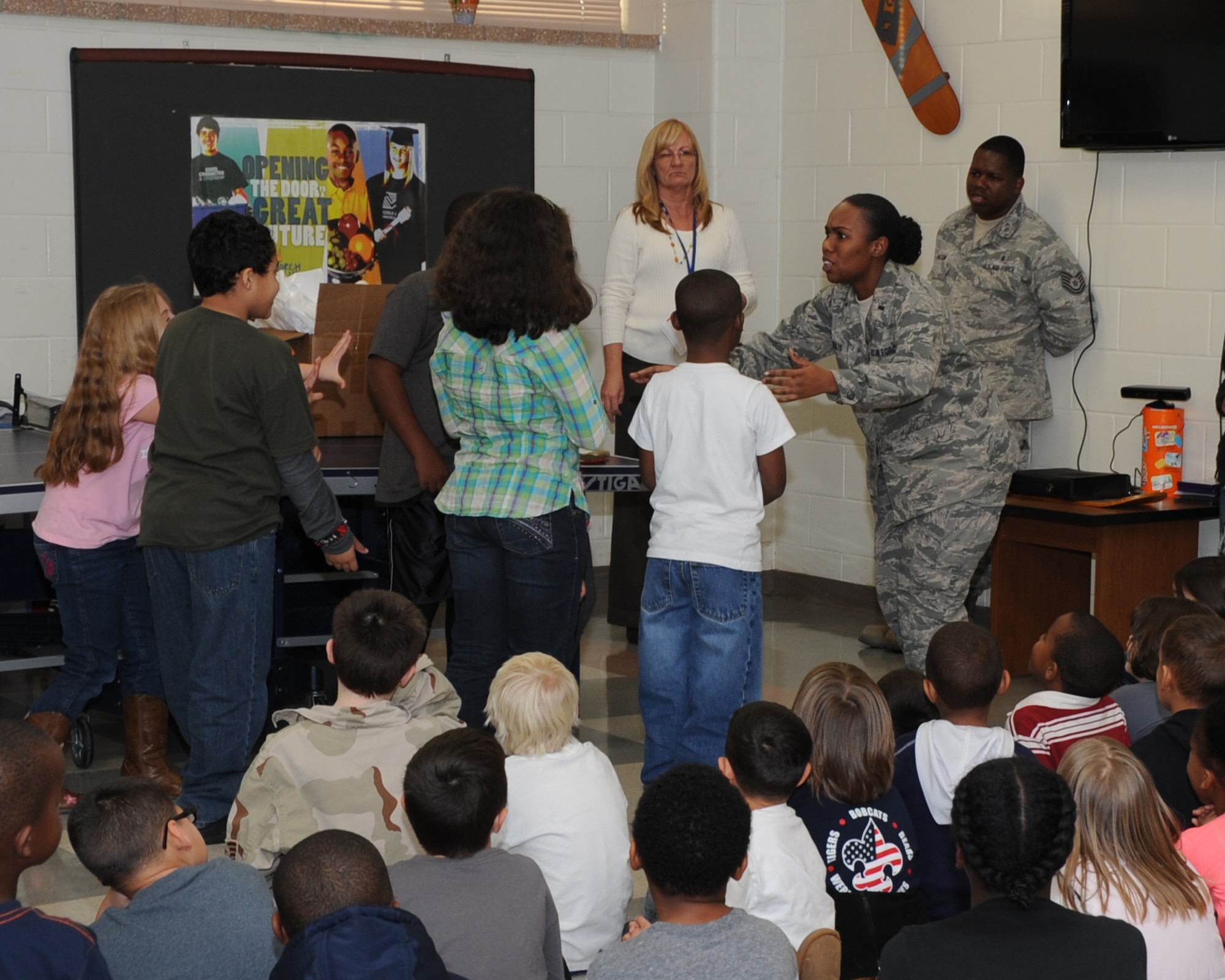 1st. Lt. Tryphena Ellis, 82nd Medical Operations Squadron Family Advocacy office, teaches children at the Sheppard Air Force Base, Texas, youth center about dealing with strangers Dec. 6, 2012.  Children were educated on "stranger danger" by using real-life scenarios the children could find themselves in. (U.S. Air Force photo/Joshua Felton)
