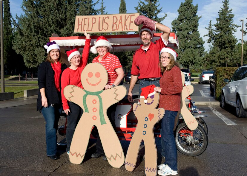 Members of Team Incirlik gather around a gingerbread man surrey to gain
support for The Great Cookie Caper Dec. 4, 2012, at Incirlik Air Base,
Turkey. The event was created to gather enough cookies to distribute to the
unaccompanied Airmen in the dorms at Incirlik and servicemembers in
geographically-separated units attached to the 39th Air Base Wing. Almost
600 dozen cookies were collected. (U.S. Air Force photo by Staff Sgt.
Marissa Tucker/Released)
