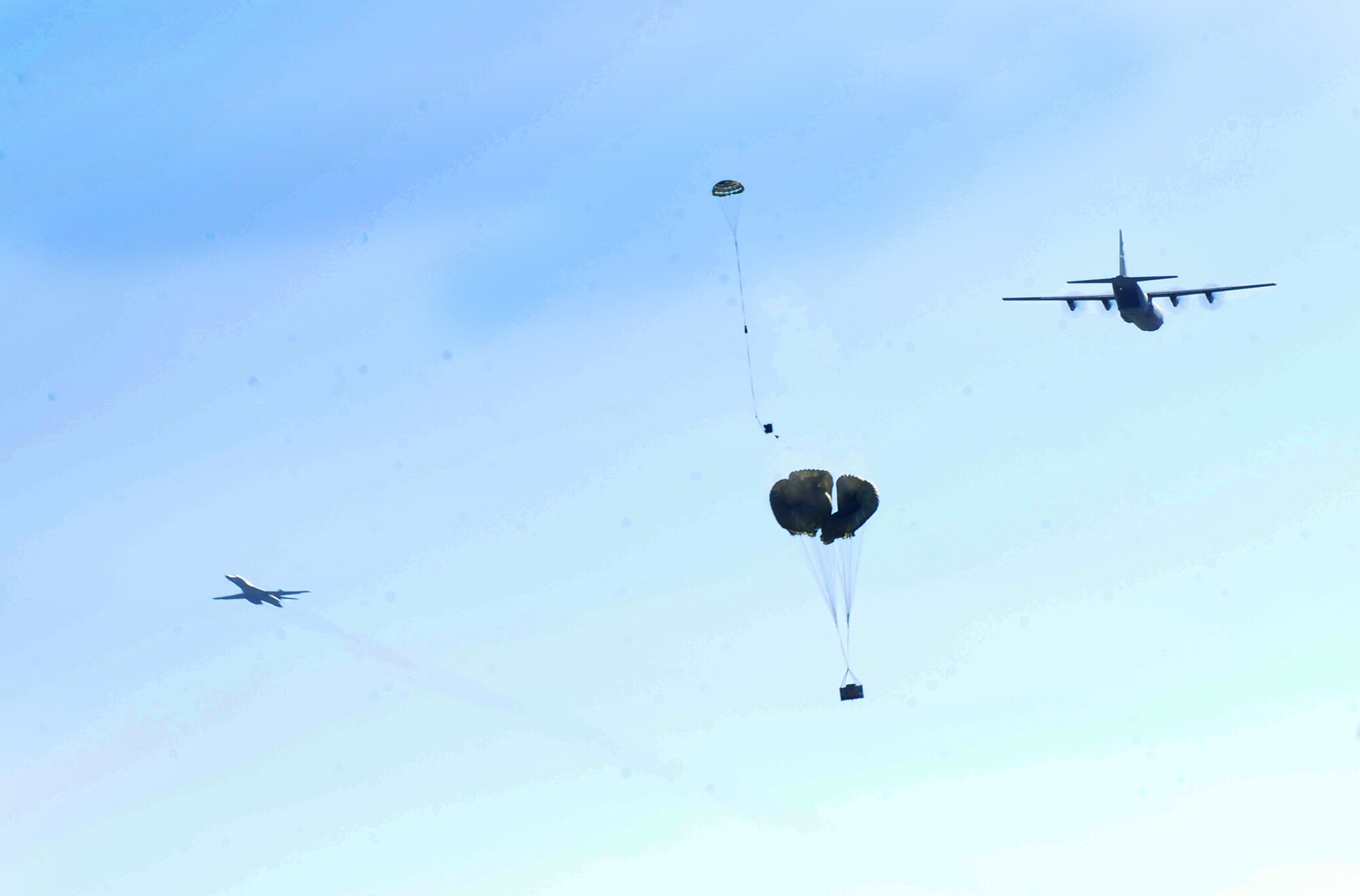 A C-130J from the 317th Airlift Group releases an airdrop bundle during Impact Day Dec. 7, 2012, at Dyess Air Force, Texas. Maintainers from the 317th Airlift Group learned the outcome of generating an aircraft when it flies and resupplies a drop zone. (U.S. Air Force photo by Senior Airman Chelsea Browning/ Released)