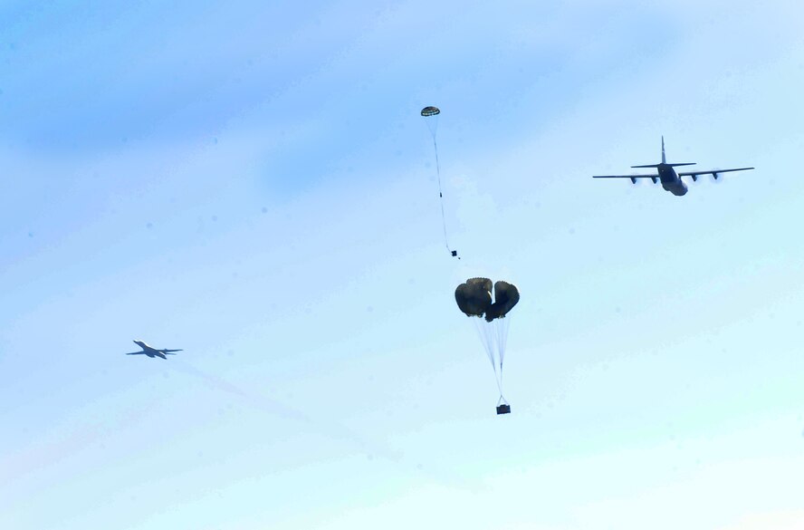 A C-130J from the 317th Airlift Group releases an airdrop bundle during Impact Day Dec. 7, 2012, at Dyess Air Force, Texas. Maintainers from the 317th Airlift Group learned the outcome of generating an aircraft when it flies and resupplies a drop zone. (U.S. Air Force photo by Senior Airman Chelsea Browning/ Released)