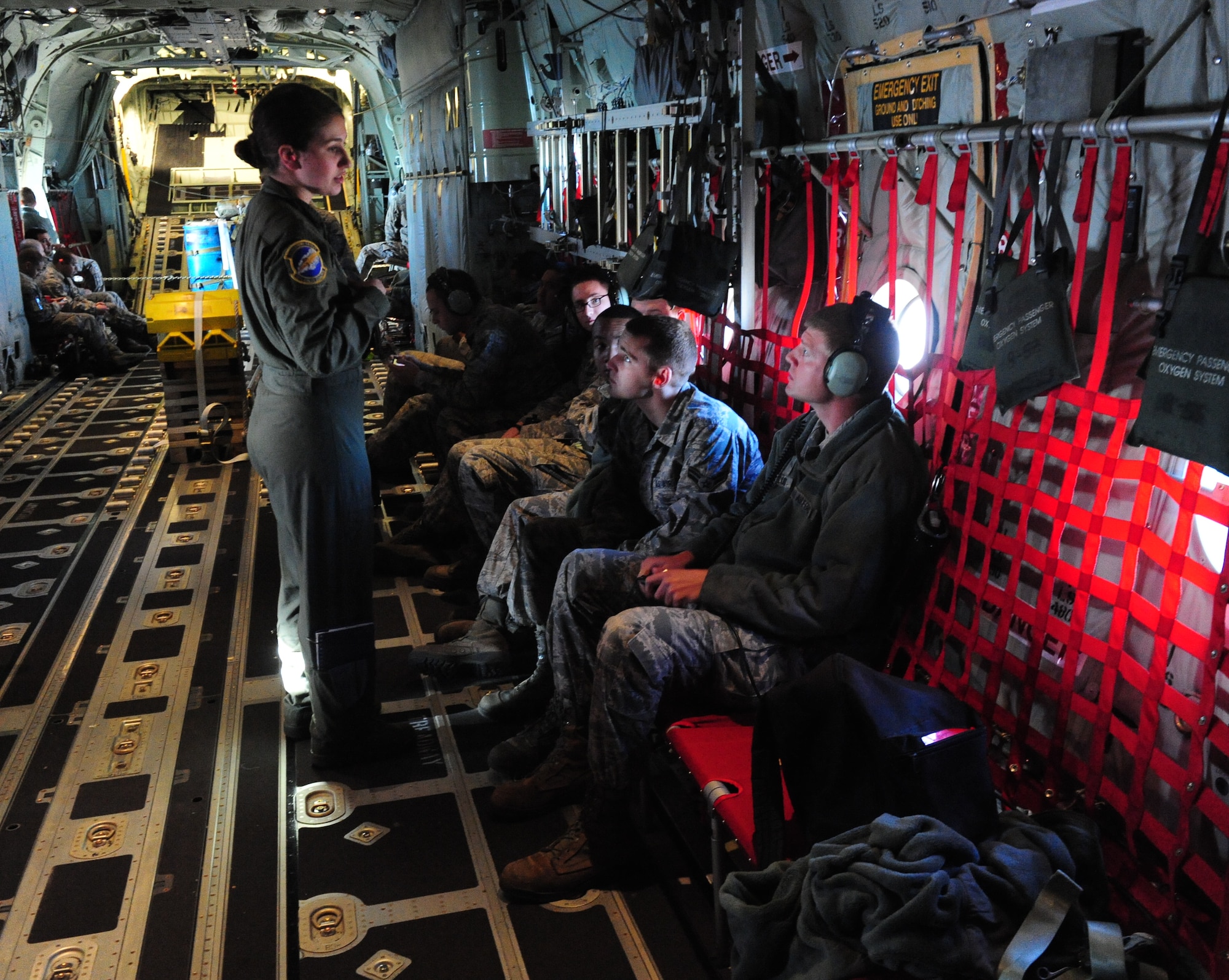 Airmen from the 317th Airlift Group ride on a C-130J incentive flight during Impact Day Dec. 7, 2012, at Dyess Air Force Base, Texas. Maintainers from the 317th Airlift Group learned the outcome of generating an aircraft when it flies and resupplies a drop zone. (U.S. Air Force photo by Senior Airman Chelsea Browning/ Released)
