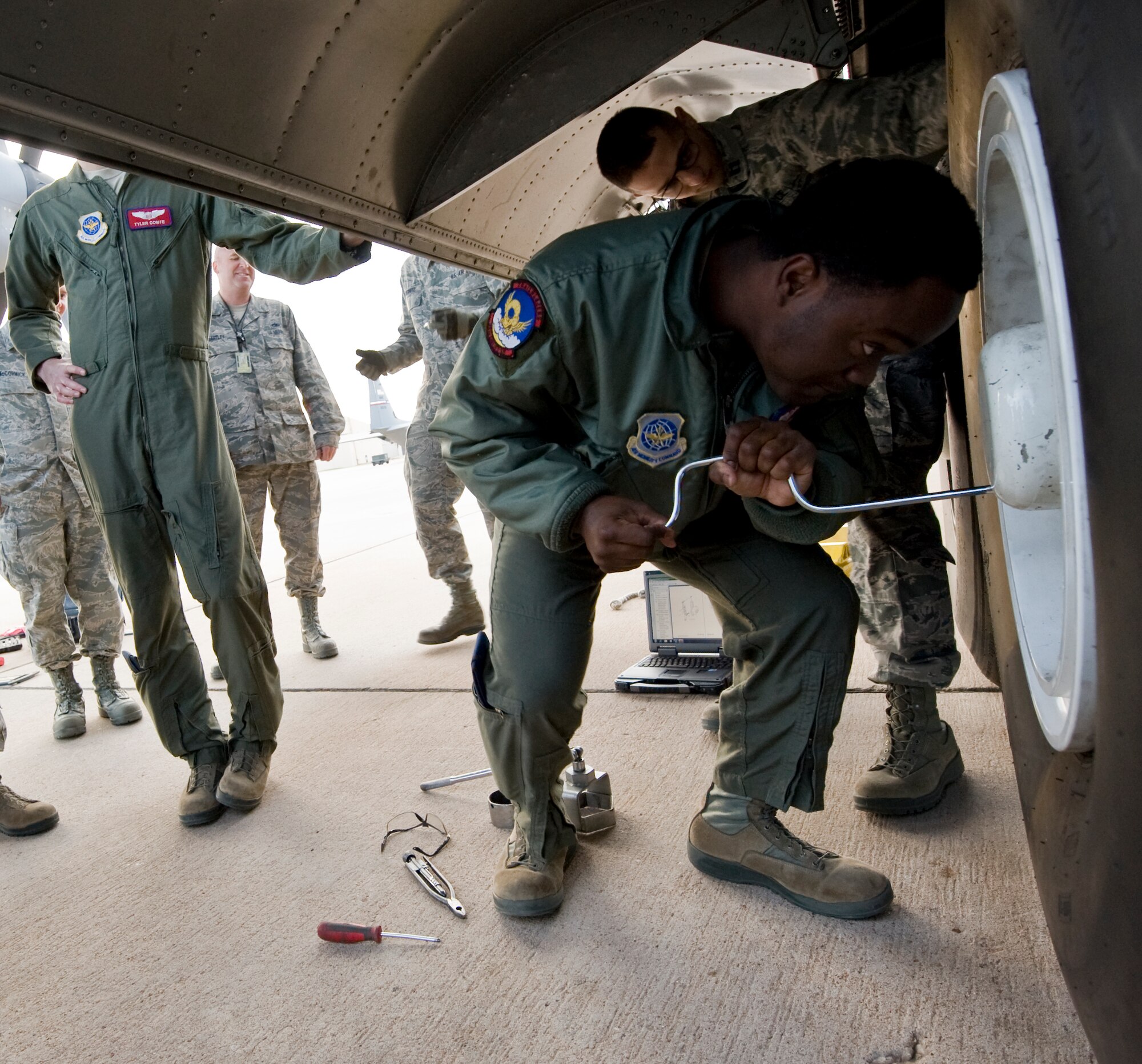 Airman 1st Class Jaime Richardson-Granger, 39th Airlift Squadron, changes a tire on a C-130J during Impact Day Dec. 7, 2012, at Dyess Air Force Base, Texas. Impact Day gave aircrew the opportunity to see what it takes to generate an aircraft with hands-on experience. The aircrew also learned how to pack a parachute, maintain a C-130J and repair a leak in a fuel cell. (U.S. Air Force photo by Airman 1st Class Jonathan Stefanko/ Released)