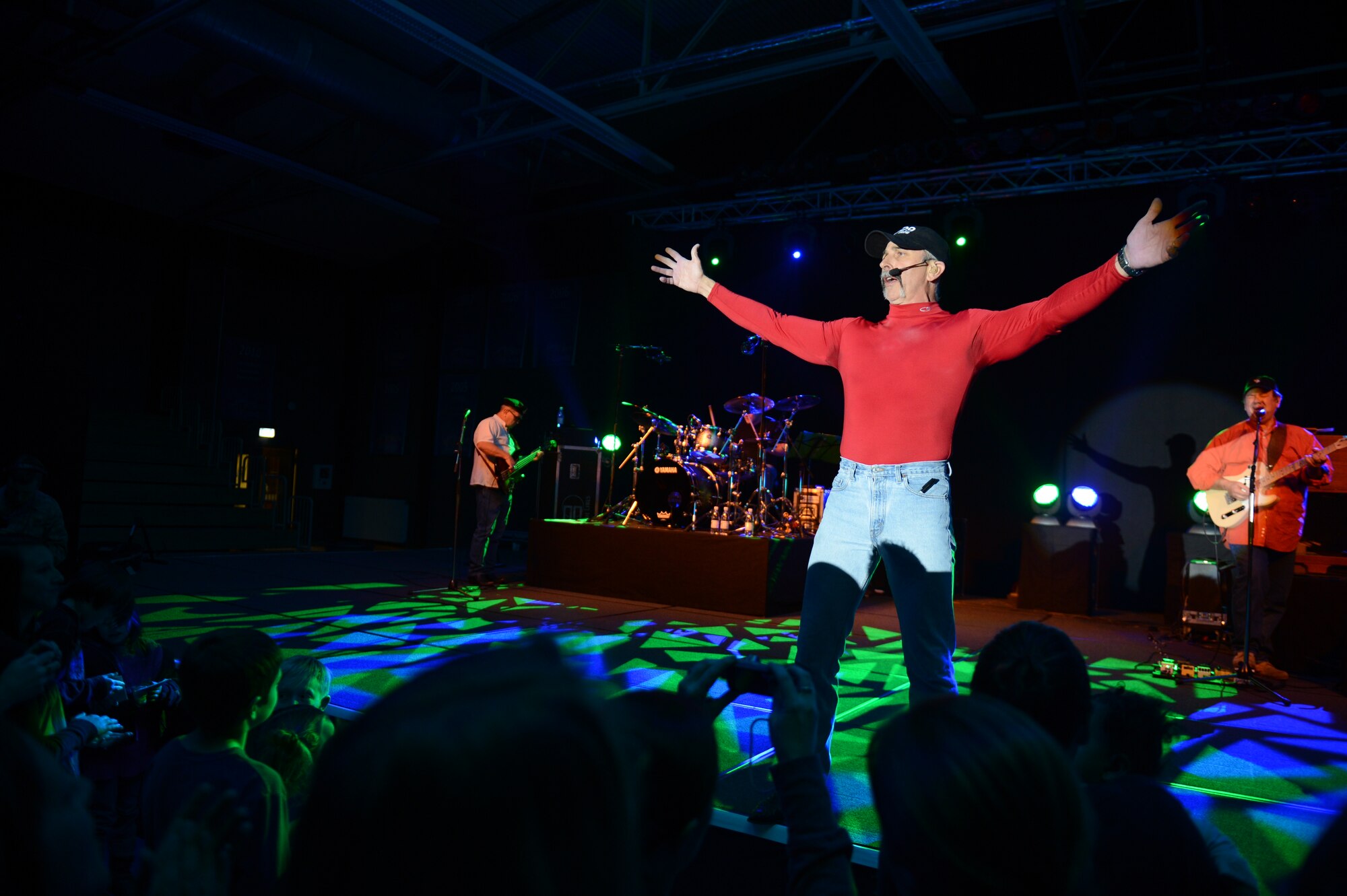 SPANGDAHLEM AIR BASE, Germany – Country music singer Aaron Tippin performs during an Armed Forces Entertainment tour inside the Skelton Memorial Fitness Center Dec. 7, 2012. AFE is an organization that brings musicians, comedians, cheerleaders and celebrities of sports, movies and television to perform for military members worldwide. (U.S. Air Force photo by Airman 1st Class Gustavo Castillo/Released)