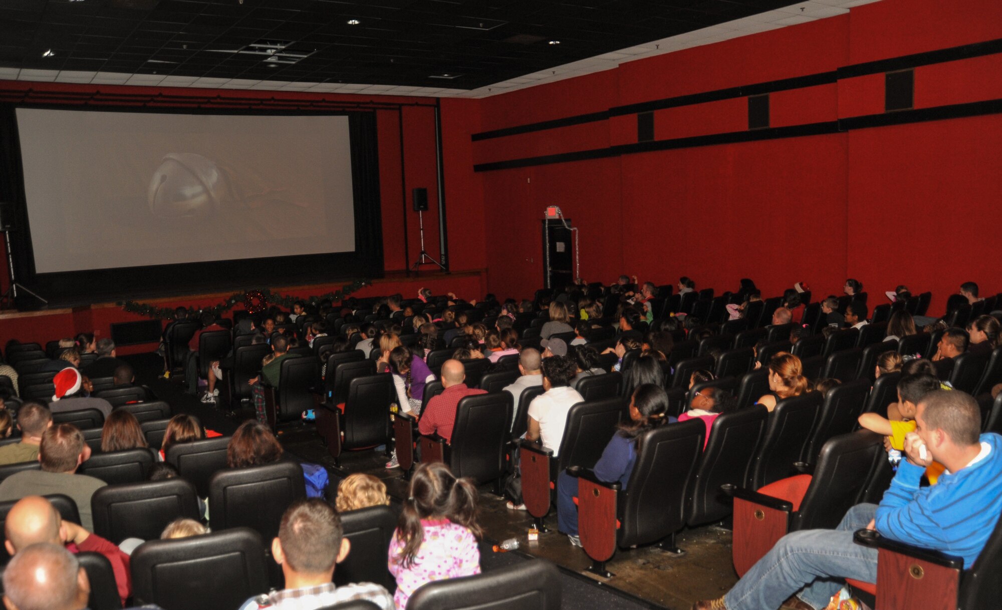 Children and adults filled the seats of the Lajes theater to view the holiday movie "The Polar Express." They then enjoyed a simulated train ride through a Winter Wonderland and ended the night with a holiday tree lighting ceremony on Lajes. This was the kickoff to a series of December holiday events on Lajes. (U.S. Air Force photo by Staff Sgt. Angelique N. Smythe)