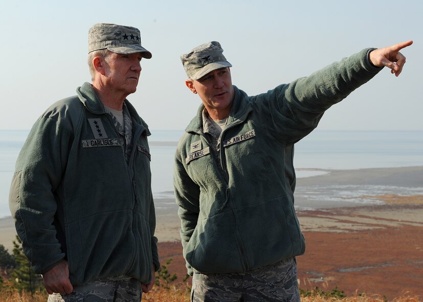 Gen. Herbert Carlisle, Pacific Air Forces commander, listens to Col. John Pearse, 8th Fighter Wing commander, during a visit to Kunsan Air Base, Republic of Korea, Nov. 30, 2012. The general visited Kunsan to learn more about the base’s mission and capabilities. (U.S. Air Force photo by Staff Sgt. Jonathan Fowler/Released)