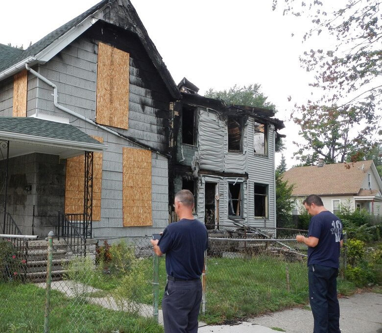 Detroit firemen checkout a vacant building using MICA software loaded into Android smart phones.  
