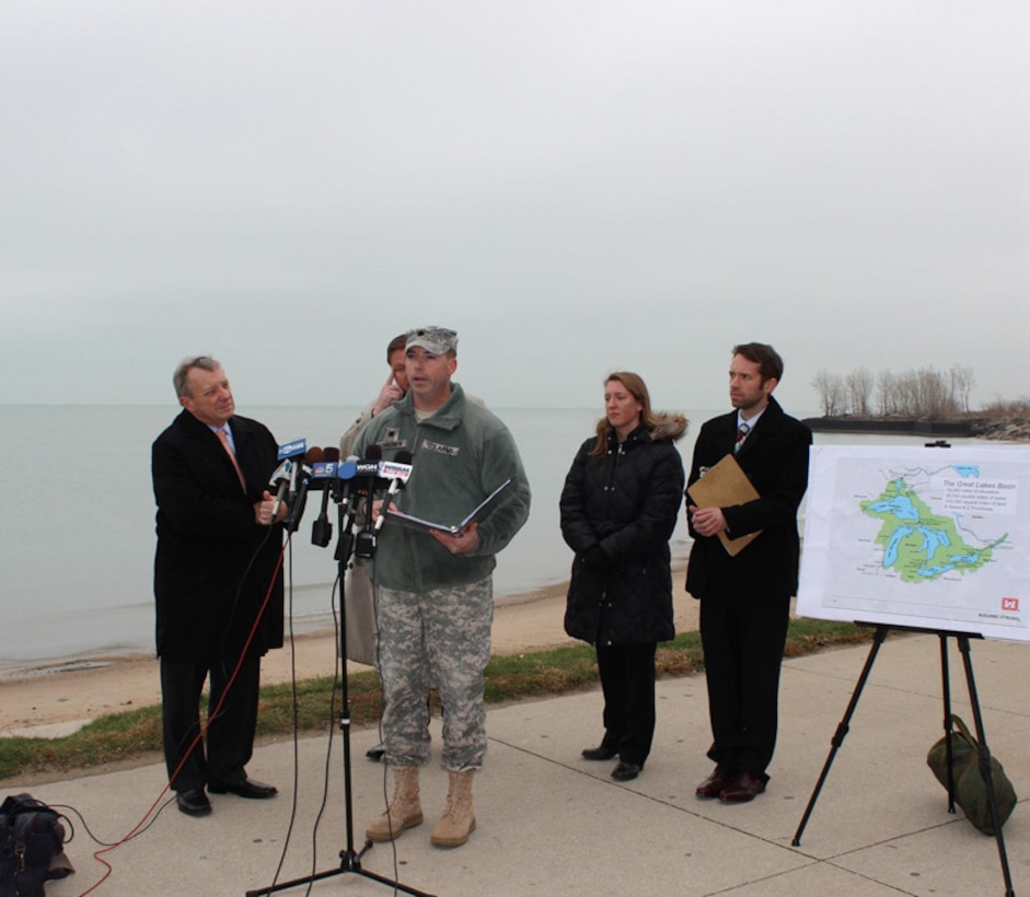 Chicago District Deputy Commander Lt. Col. Jim Schreiner speaks at Sen. Dick Durbin press event to address causes and effects of extreme weather, Chicago, Ill., Dec. 10, 2012. The Corps monitors lake levels closely. Low lake levels impact commercial and recreational navigation, water supply, hydropower, recreation and the environment. This is a complex system, and we will continue to look at all the factors to include potential climate change effects on this resource, said Schreiner. (U.S. Army Photo by Sarah Gross) 