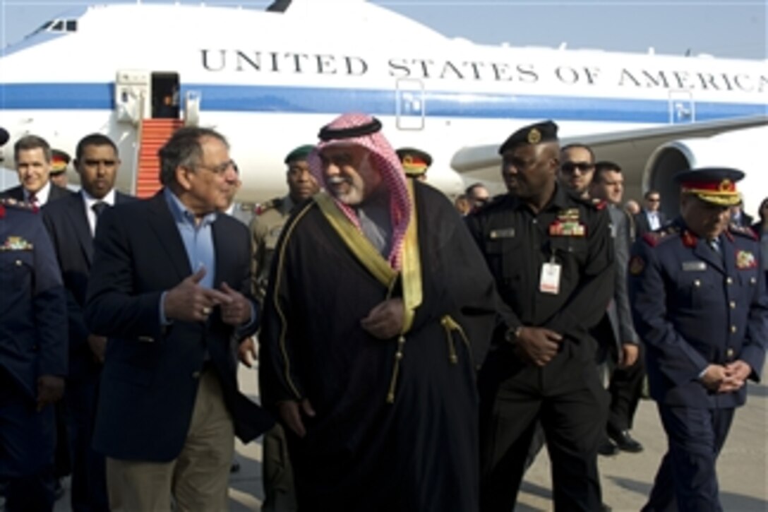 Secretary of Defense Leon E. Panetta, left, walks with First Deputy Prime Minister and Minister of Defense of the State of Kuwait Sheikh Ahmed Khaled Al-Hamad Al-Sabah, center, upon his arrival in Kuwait City, Kuwait, on Dec. 11, 2012. 