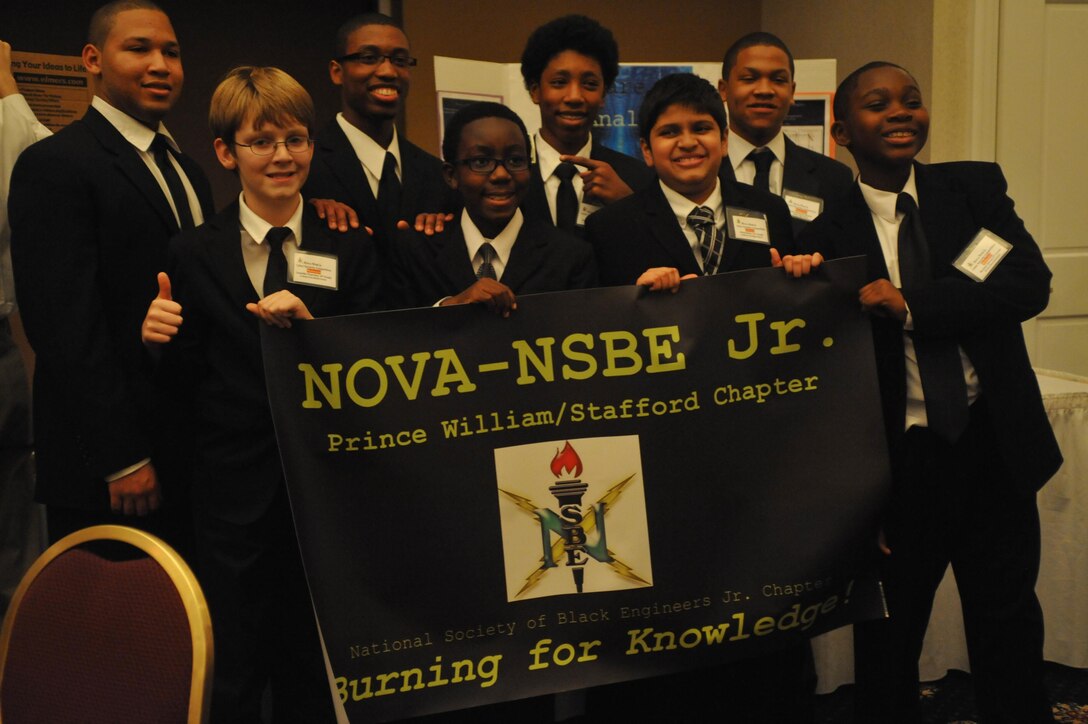 Each member of the Malware Analyst team has a smile on their face after winning the first Northern Virginia Chapter of the National Society of Black Engineers Cyber Security Event at The Clubs at Quantico on Dec. 5. Malware Analyst beat three other teams, including one comprised of all juniors and a senior, to win the event.