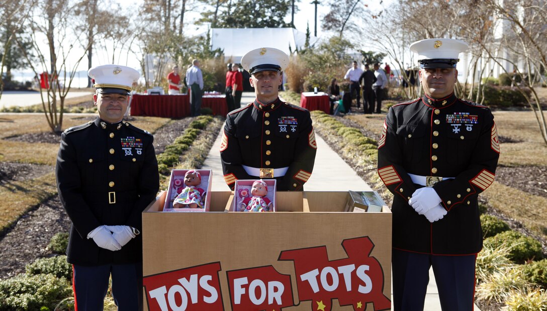 Marines stand post at a volunteer collection box for Toys for Tots at the Joint Holiday Reception aboard Marine Corps Base Camp Lejeune Dec. 1.  Leaders from Camp Lejeune and local community officials were in attendance at the annual reception.