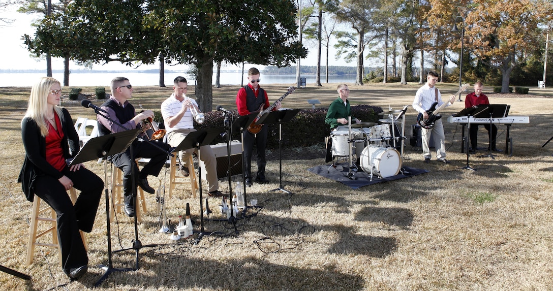 Members of the II Marine Aircraft Wing Band play live music for patrons at the Joint Holiday Reception aboard Marine Corps Base Camp Lejeune Dec. 1. The reception is hosted to give thanks for the combined cooperation of military personnel aboard the base and civilian personnel in the surrounding communities.