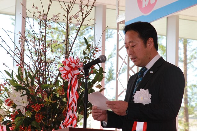 Iwakuni City Mayor Yoshihiko Fukuda speaks to distinguished guests at the Iwakuni Kintaikyo Airport opening ceremony Dec. 9, 2012. Fukuda
spoke on how the opening of airport was a new beginning for Iwakuni, but not the final goal. The airport marks the second commercial airport
using U.S. military runways in Japan. Opening of the airport also signifies the reintroduction of civil aviation in Iwakuni after 48 years.