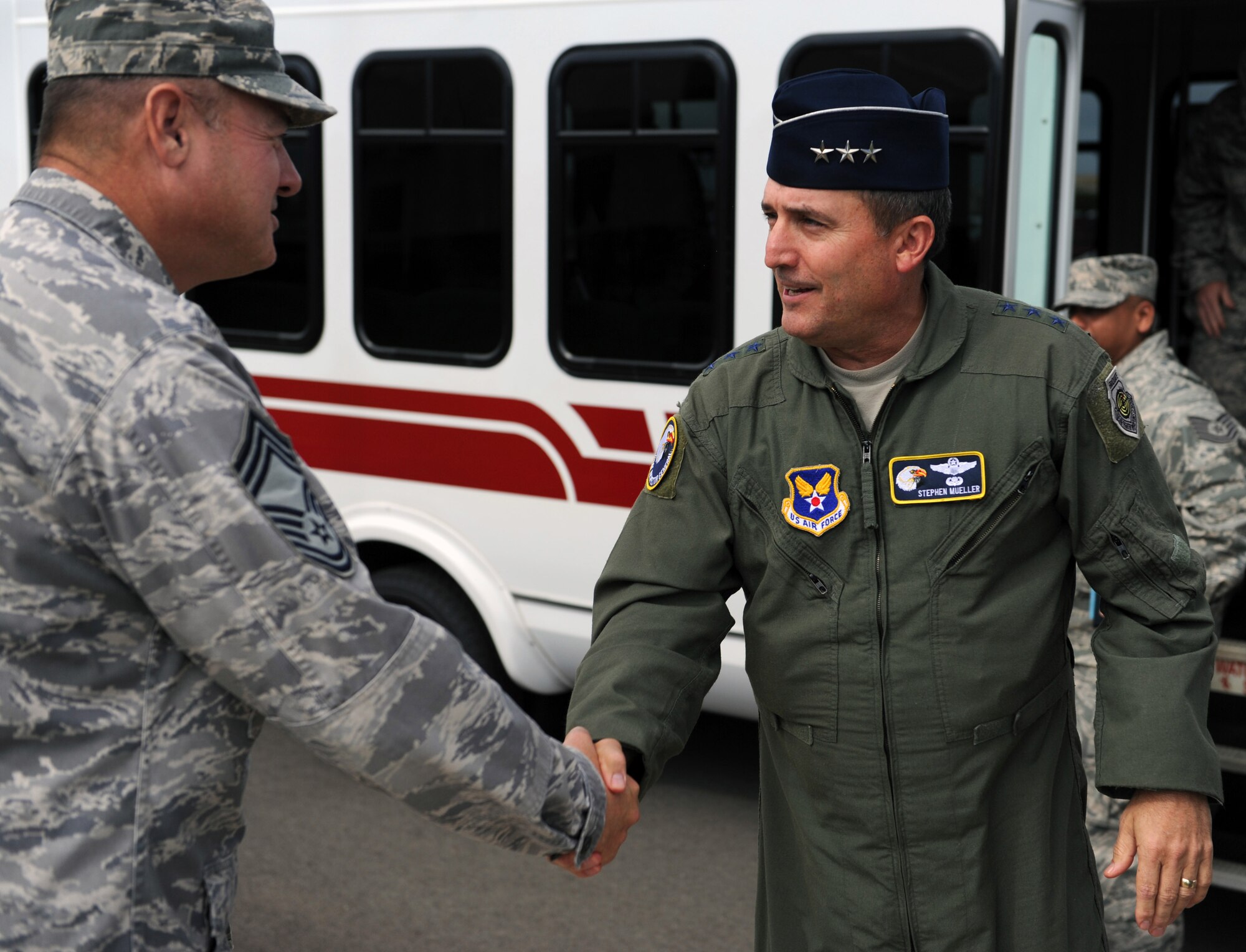 Chief Master Sgt. James Clay, 15th Maintenance Group superintendent, greets Lt. Gen. Stephen Mueller, Air Force Inspector General, at the combined maintenance facility Dec. 12 during a tour of 15th Wing units at Joint Base Pearl Harbor-Hickam, Hawaii. The Inspector General provides inspection policy and oversees the inspection and evaluation system for all Air Force nuclear and conventional forces as well as Air Force counterintelligence operations. The 15th MXG, in partnership with the Hawaii Air National Guard’s 154th Maintenance Group, is responsible for maintaining the health of the fleet to ensure safe and reliable mission execution. (U.S. Air Force photo by Staff Sgt. Nathan Allen)