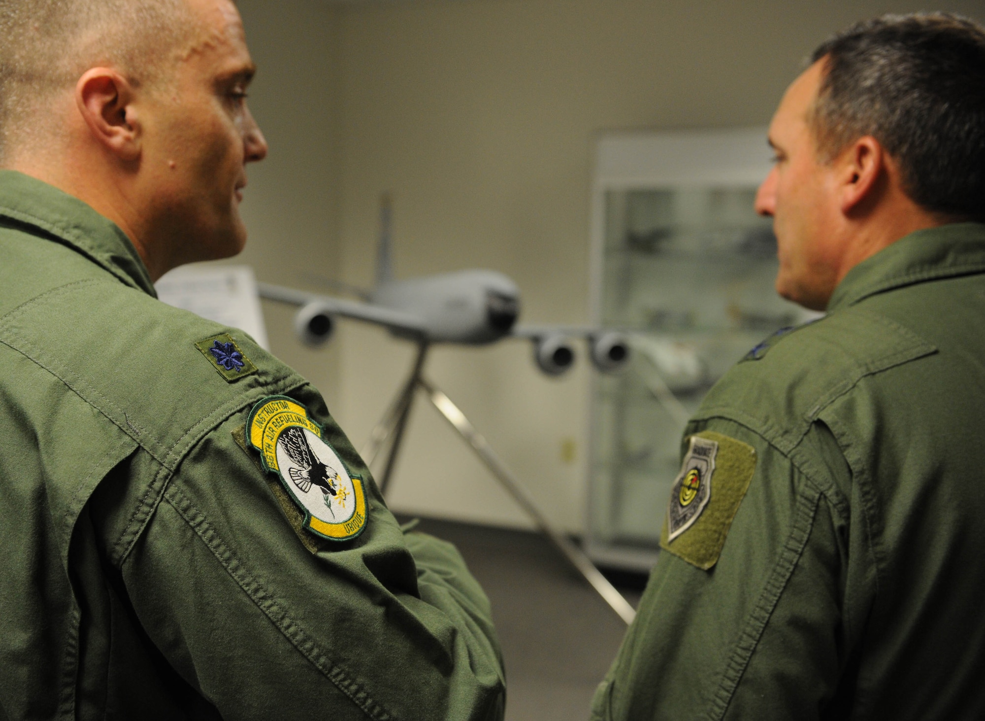 Lt. Col. Brian Deutsch, 96th Air Refueling Squadron commander, briefs Lt. Gen. Stephen Mueller, Air Force Inspector General, on the air refueling mission in Hawaii executed by the active duty 96th ARS and Hawaii Air National Guard's 203rd ARS Dec. 12 during a tour of 15th Wing units at Joint Base Pearl Harbor-Hickam, Hawaii. Along with performing duties directed by the Air Force Secretary or the Chief of Staff, Mueller is responsible for two field operating agencies: the Air Force Inspection Agency and the Air Force Office of Special Investigations. The air refueling mission in Pacific Air Forces area of responsibility extends from the west coast of the United States to the east coast of Africa and from the Arctic to the Antarctic - more than 100 million square miles. The area contains 44 countries and nearly 2 billion people. (U.S. Air Force photo by Staff Sgt. Nathan Allen)