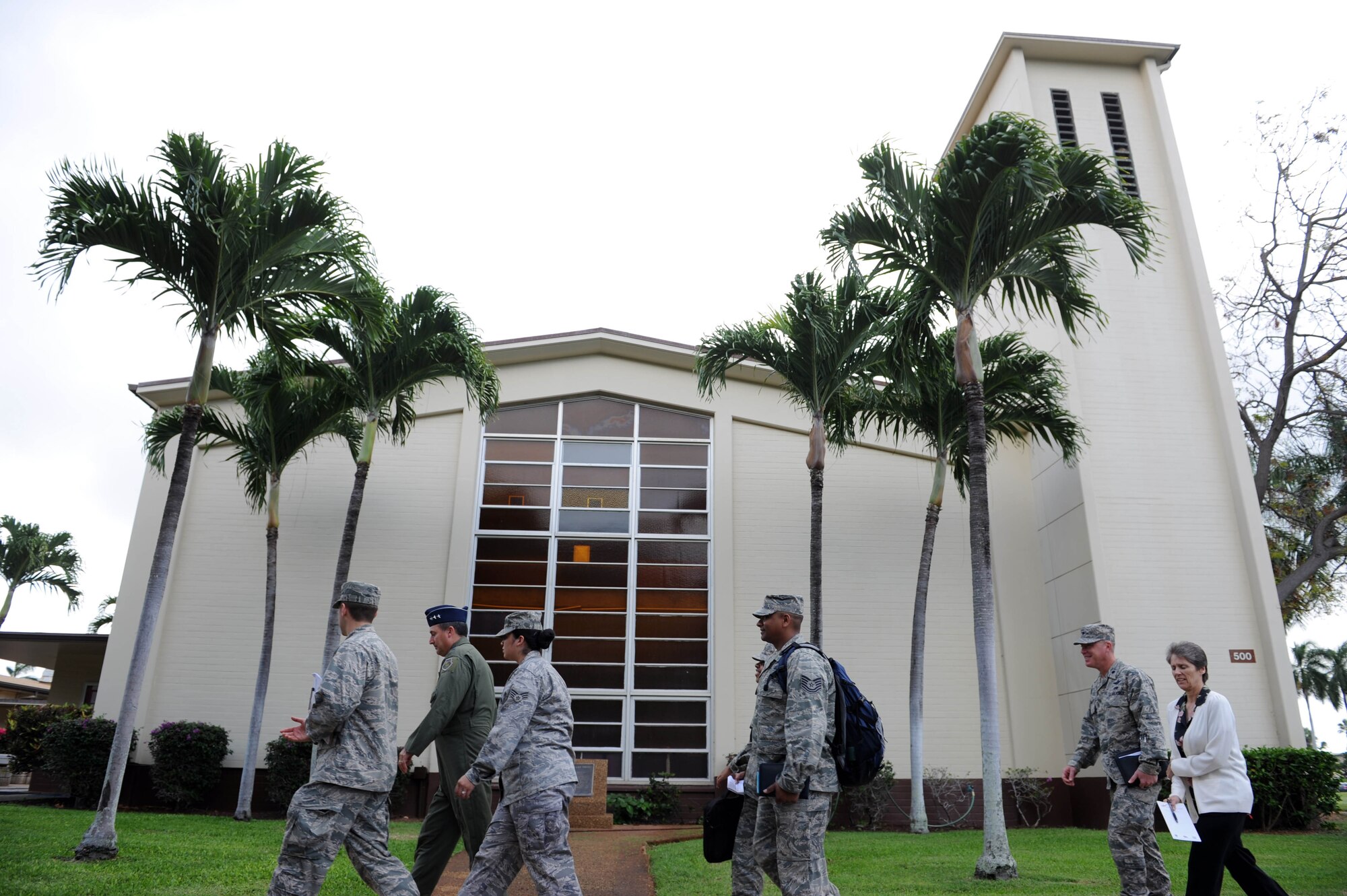 Lt. Gen. Stephen Mueller, Air Force Inspector General, walks in front of the Nelles Chapel Dec. 12 on his way to speak with 15th Wing Sexual Assault Response Victim Advocates at Joint Base Pearl Harbor-Hickam, Hawaii. The Inspector General provides inspection policy and oversees the inspection and evaluation system for all Air Force nuclear and conventional forces as well as Air Force counterintelligence operations. The Air Force Sexual Assault Prevention and Response Program office is progressively influencing the way the military responds to sexual assault and rape by changing the perceptions of Soldiers, Sailors, Airmen, Marines and Coast Guardsmen. (U.S. Air Force photo by Staff Sgt. Nathan Allen)