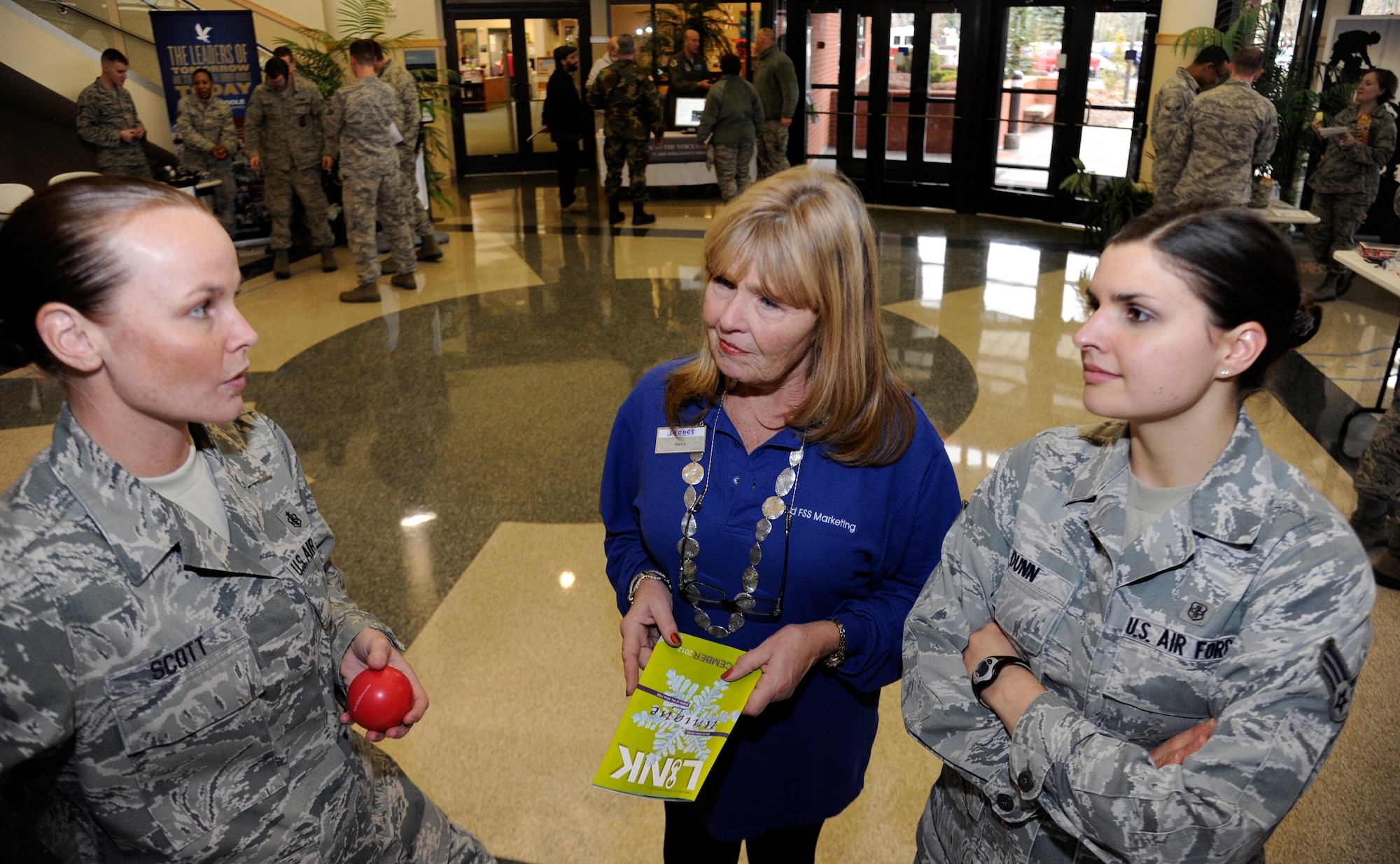 Staff Sgt. Bethany Scott, 92nd Aerospace Medical Squadron aerospace and operational physiology craftsman, briefs Nancy Collins 92nd Force Support Squadron commercial sponsor and advertising coordinator and Senior Airman Erin Dunn, 92nd Medical Operations Squadron alcohol drug abuse and treatment technician on how the effects of fatigue and lack of sleep have on our bodies at the Driving Under the Influence fair at Fairchild Air Force Base, Wash., Dec. 4, 2012. Driving a vehicle while being sleep deprived can produce the same effects of being under the influence of alcohol.  (U.S. Air Force photo by Airman 1st Class Ryan Zeski)