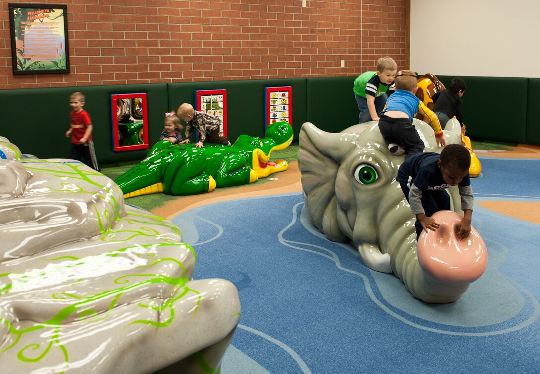 Ellsworth children play in the Safariland play area in the Holbrook Library at Ellsworth Air Force Base, S.D., Dec. 7, 2012. The play area is open from 9:30 a.m. to 6:30 p.m., Monday through Friday, and Saturdays from 9:30 a.m. to 4:30 p.m., for children ages 6 and younger to enjoy. (U.S. Air Force photo by Airman 1st Class Alystria Maurer/Released)